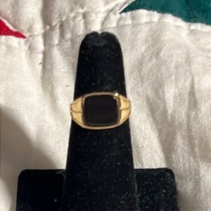 Gold colored pinky ring